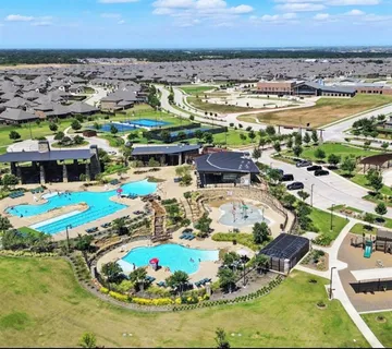 a view of a swimming pool and an outdoor space