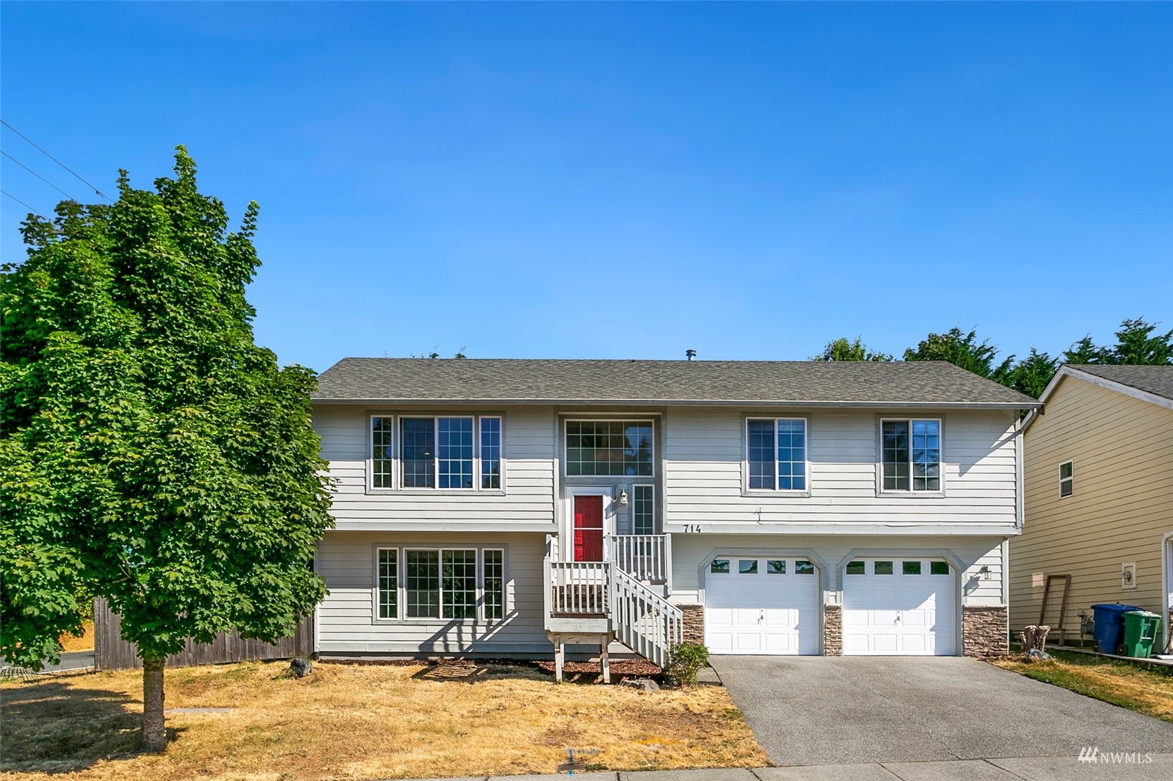 714 Northwest 3rd Court Renton, WA 98057 - Photo 1 of 40 a front view of a house with a yard