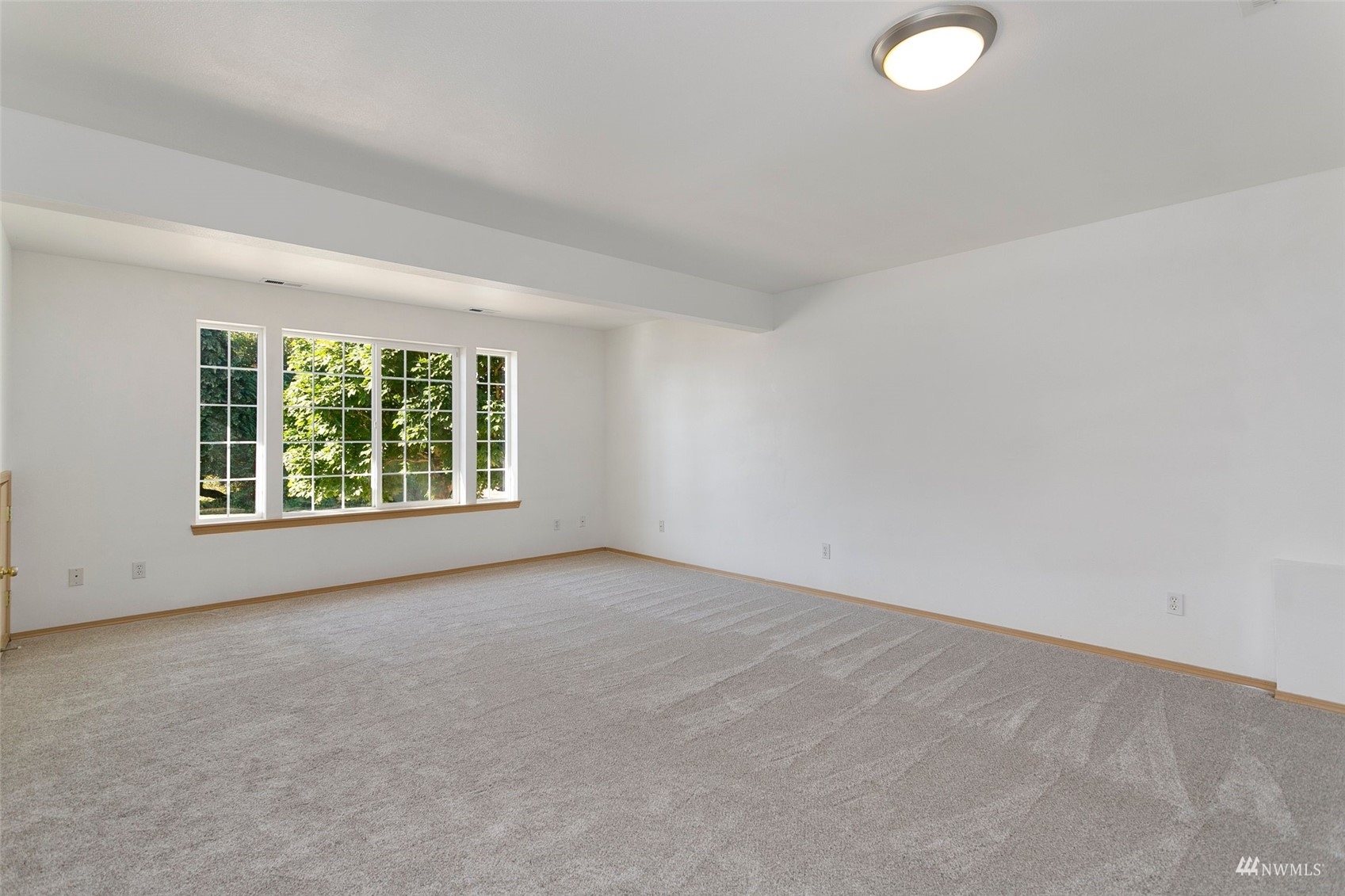 714 Northwest 3rd Court Renton, WA 98057 - Photo 14 of 40 an empty room with windows