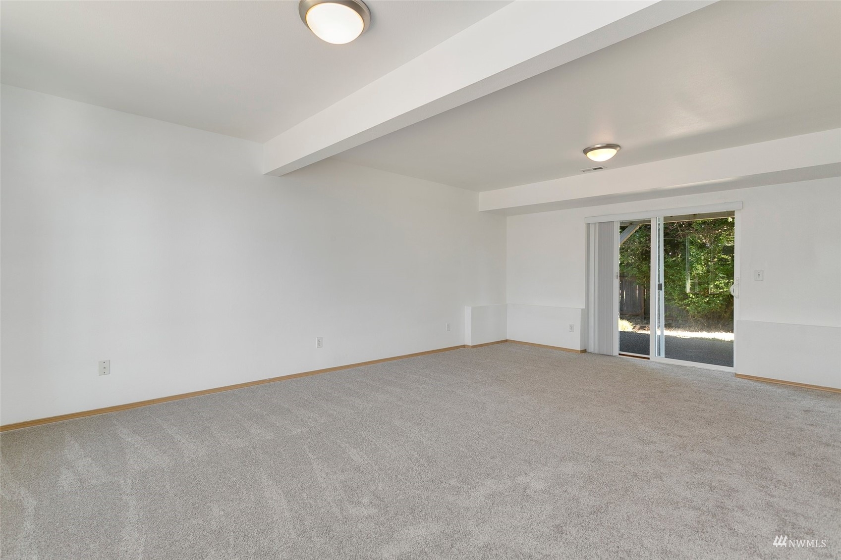 714 Northwest 3rd Court Renton, WA 98057 - Photo 15 of 40 an empty room with windows and yard