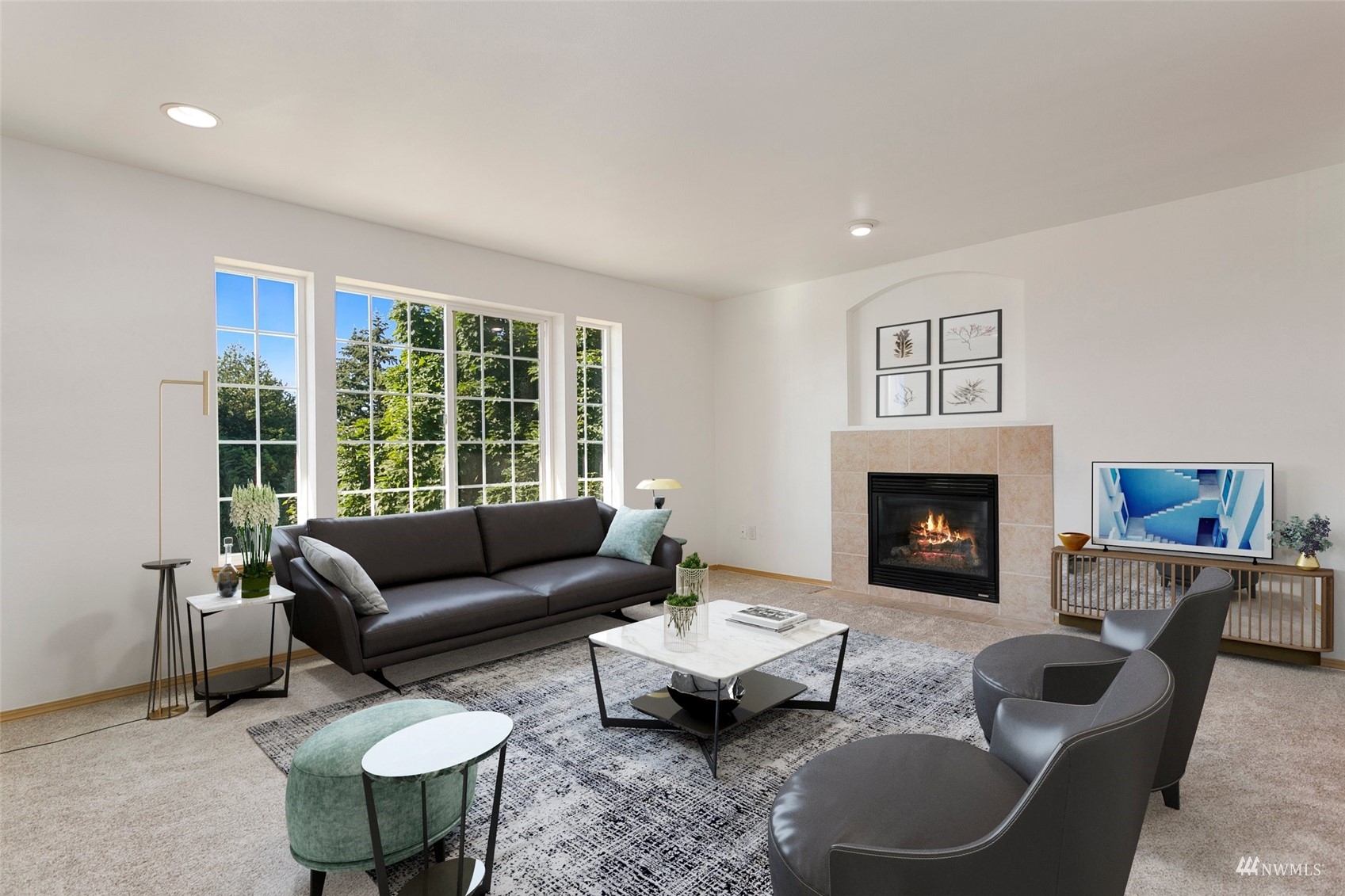 714 Northwest 3rd Court Renton, WA 98057 - Photo 2 of 40 a living room with furniture and a fireplace