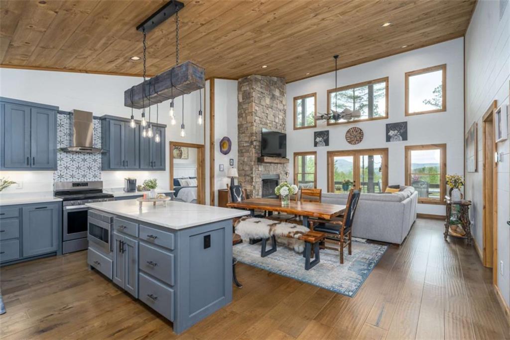 454 North Old Aska Road Blue Ridge, GA 30513 - Photo 11 of 33 a large white kitchen with a large window and counter space