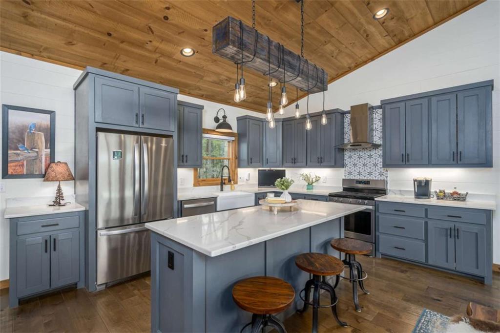 454 North Old Aska Road Blue Ridge, GA 30513 - Photo 13 of 33 a kitchen with sink cabinets and wooden floor