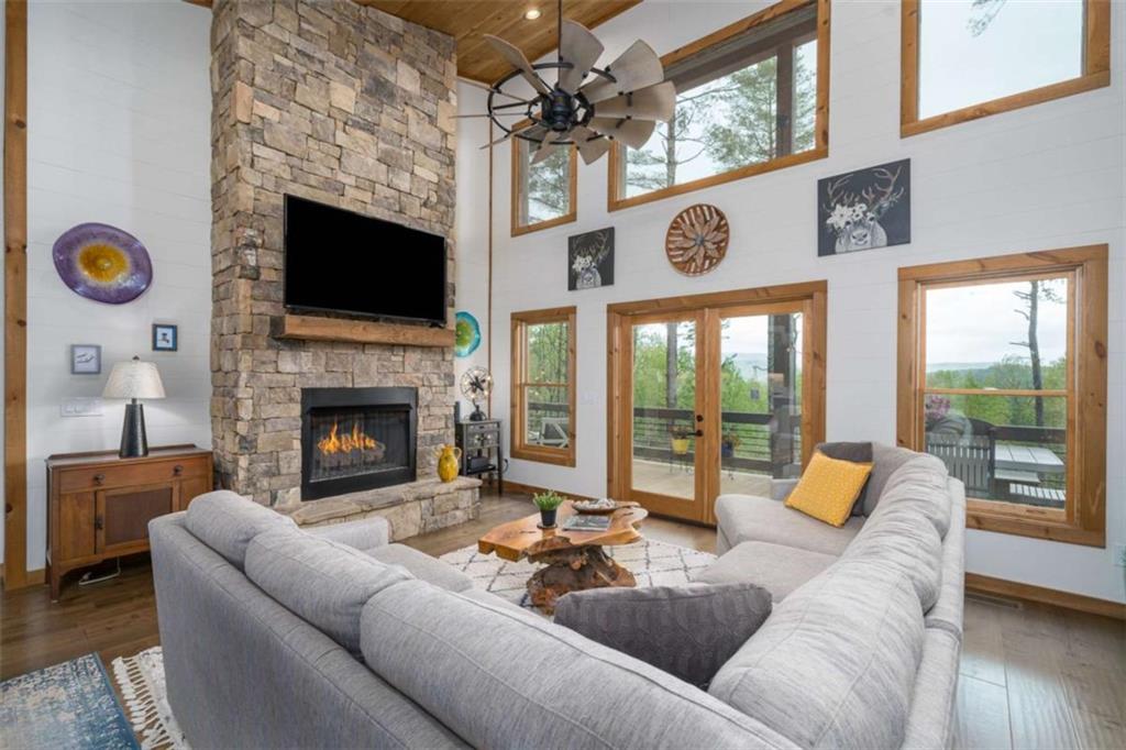 454 North Old Aska Road Blue Ridge, GA 30513 - Photo 14 of 33 a living room with furniture and a fireplace