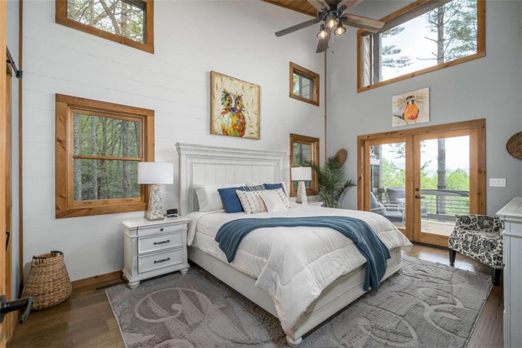 454 North Old Aska Road Blue Ridge, GA 30513 - Photo 15 of 33 a bedroom with a bed couch and window