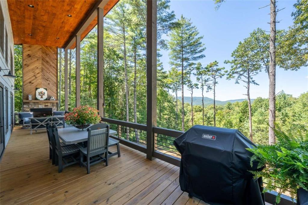 454 North Old Aska Road Blue Ridge, GA 30513 - Photo 32 of 33 a view of balcony with chair and wooden fence