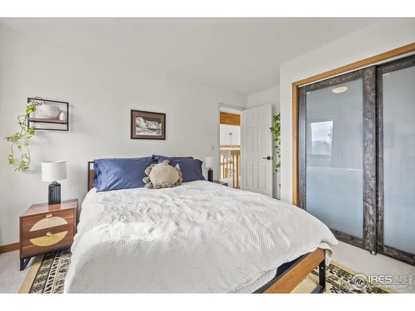 a bedroom with a bed and a cabinets