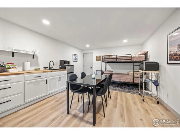 a open kitchen with stainless steel appliances kitchen island granite countertop a sink and cabinets