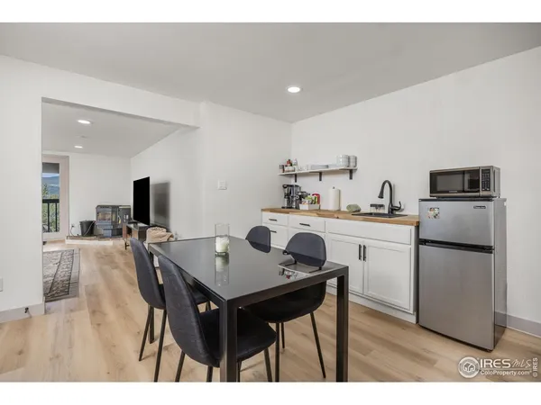 a kitchen with a table and chairs in it