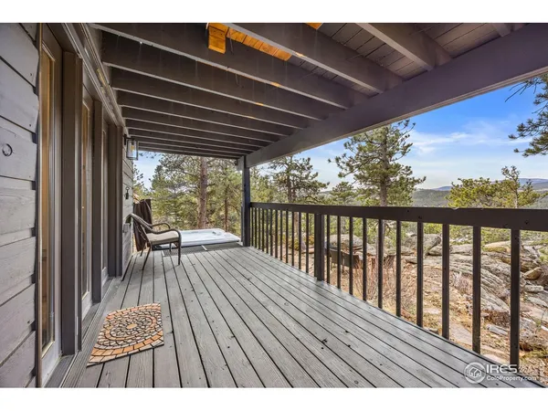 a view of balcony with wooden floor
