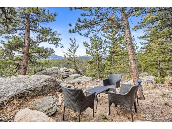 a view of a chairs and table in the outdoor