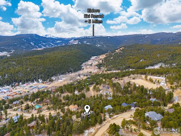 a view of a field with an ocean