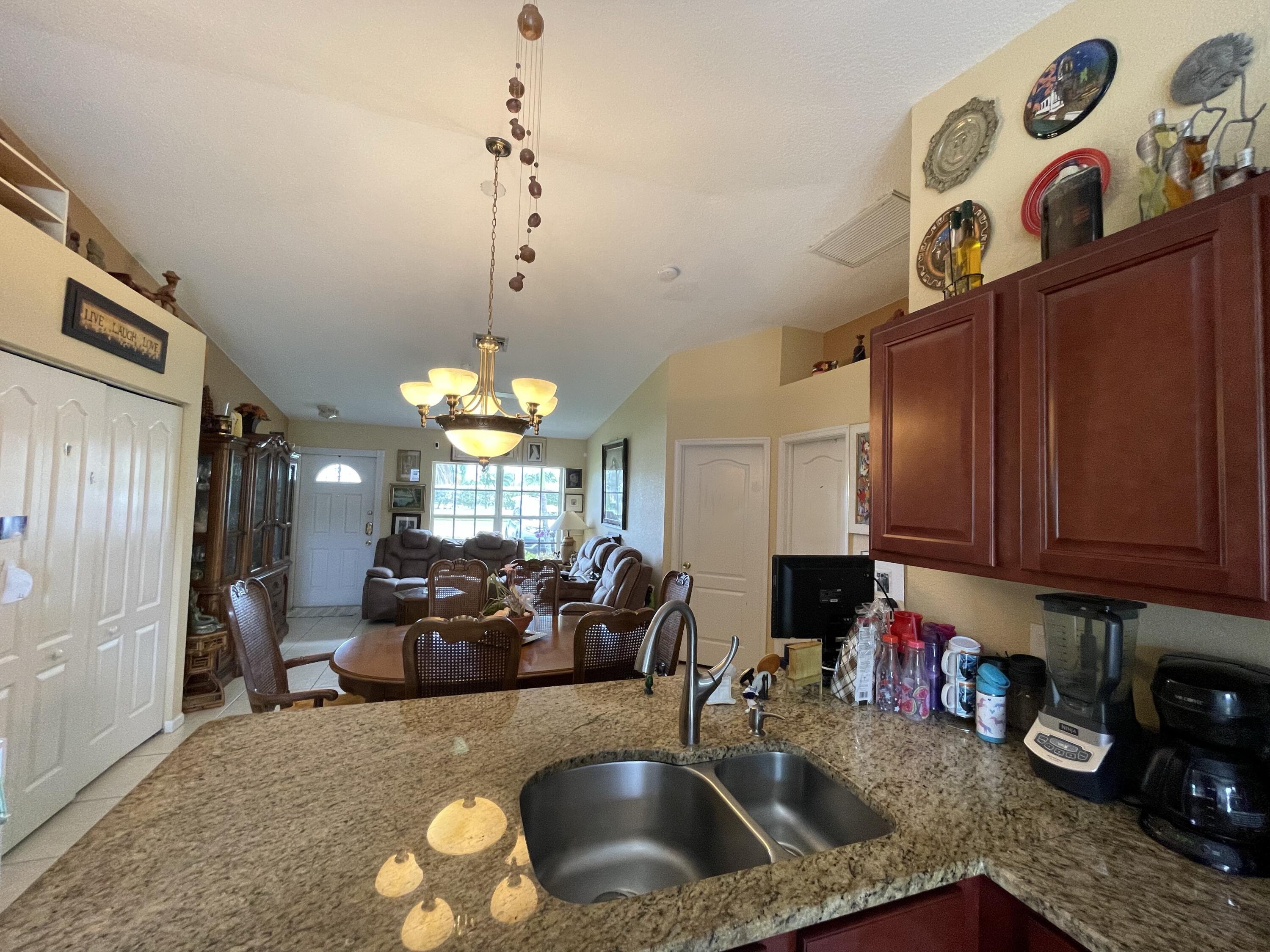 4369 Dale Road Palm Springs, FL 33406 - Photo 12 of 14 VIEW FROM KITCHEN