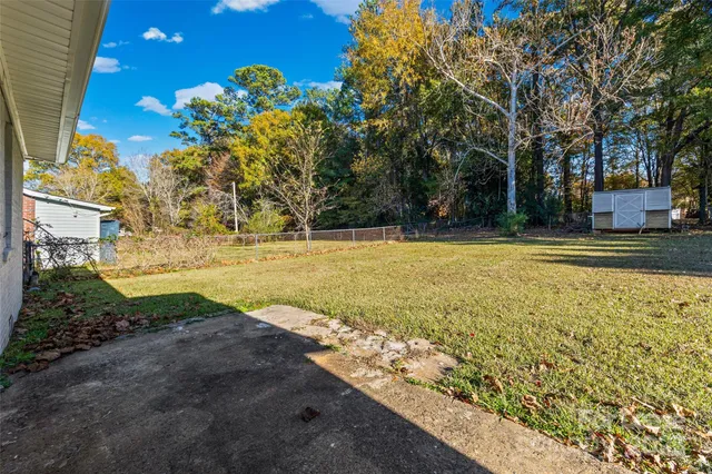 a view of a yard with swimming pool