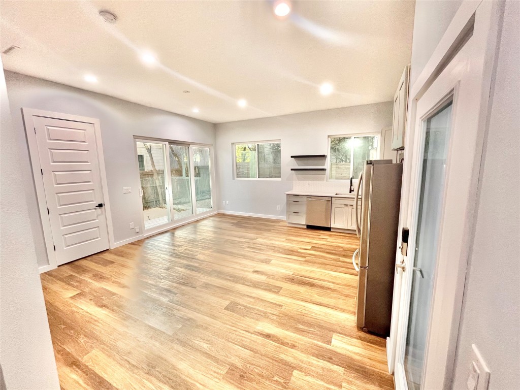 3508 Robinson Avenue, Unit B Austin, TX 78722 - Photo 17 of 17 a room with a bed and a view of kitchen