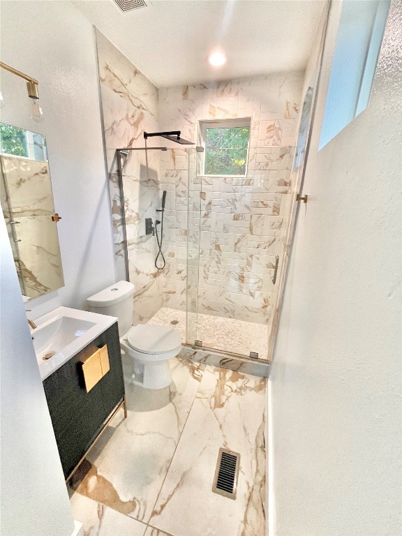 3508 Robinson Avenue, Unit B Austin, TX 78722 - Photo 9 of 17 a bathroom with a sink toilet and shower