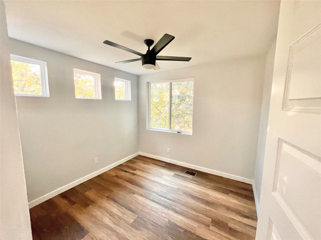 3508 Robinson Avenue, Unit B Austin, TX 78722 - Photo 10 of 17 a view of empty room with wooden floor and fan