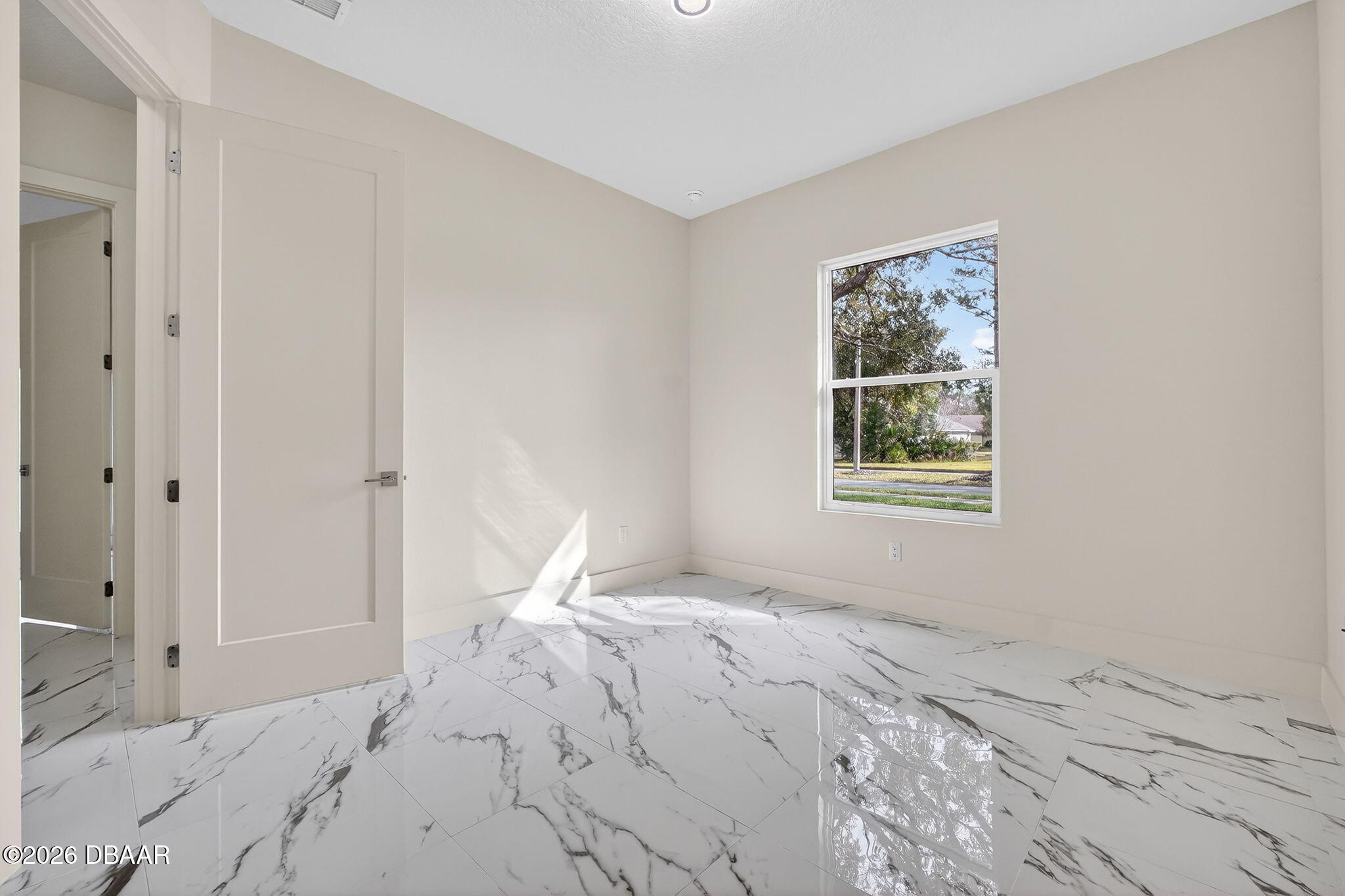 2 Huntsman Look Ormond Beach, FL 32174 - Photo 27 of 57 a view of a bedroom with a bed and a window