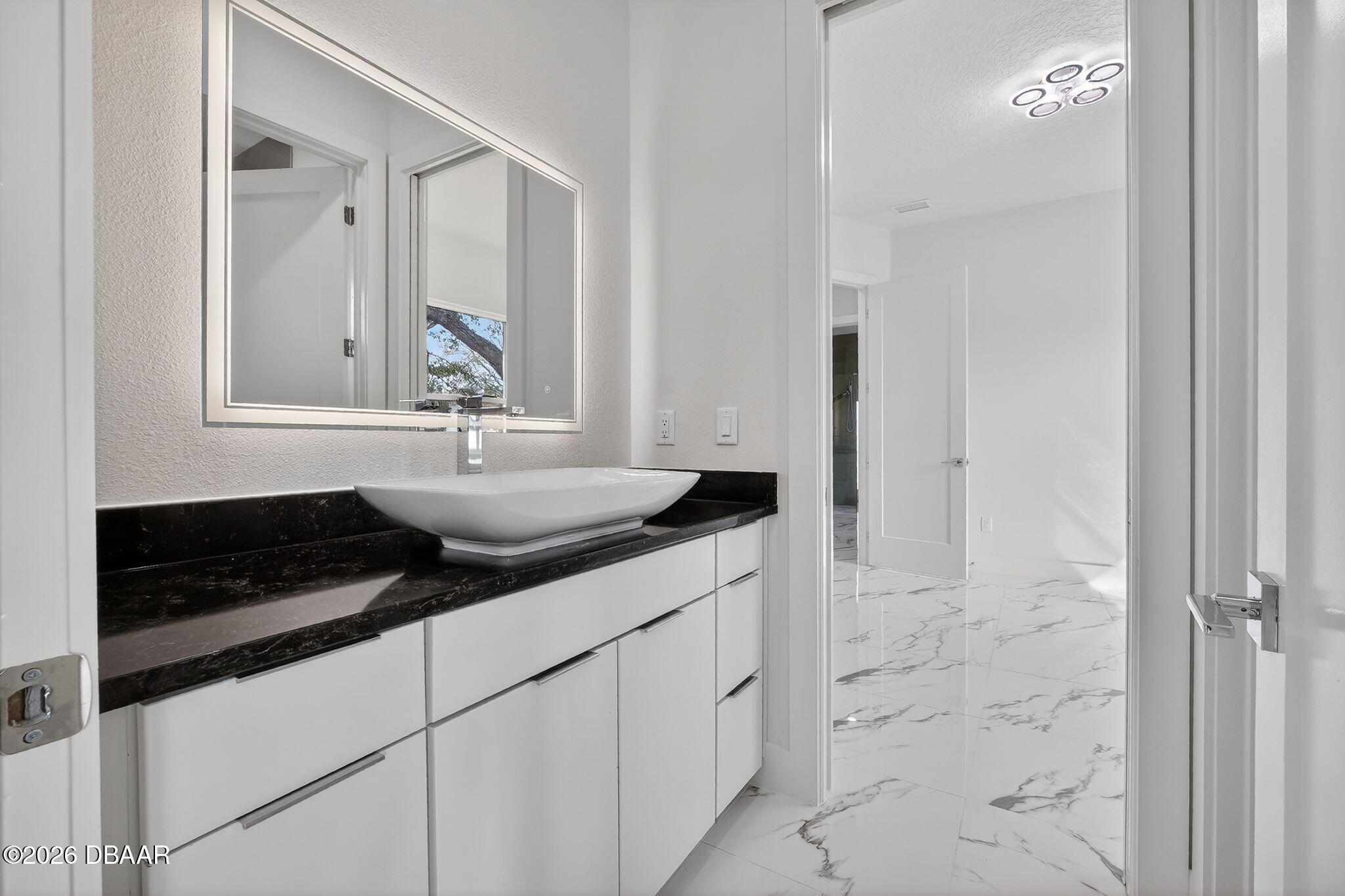 2 Huntsman Look Ormond Beach, FL 32174 - Photo 28 of 57 a bathroom with a sink and a mirror