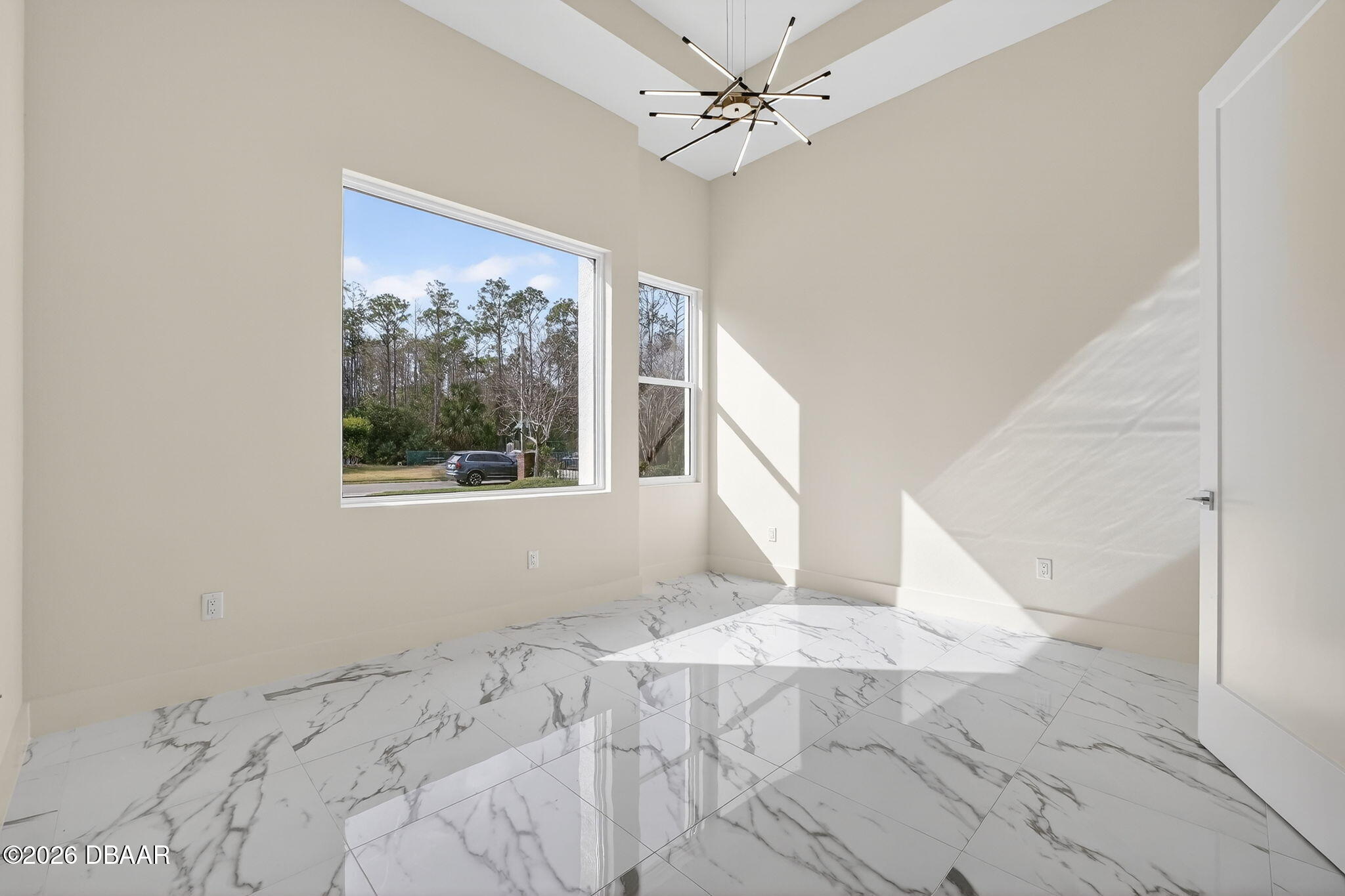 2 Huntsman Look Ormond Beach, FL 32174 - Photo 34 of 57 a view of a big room with windows and chandelier fan