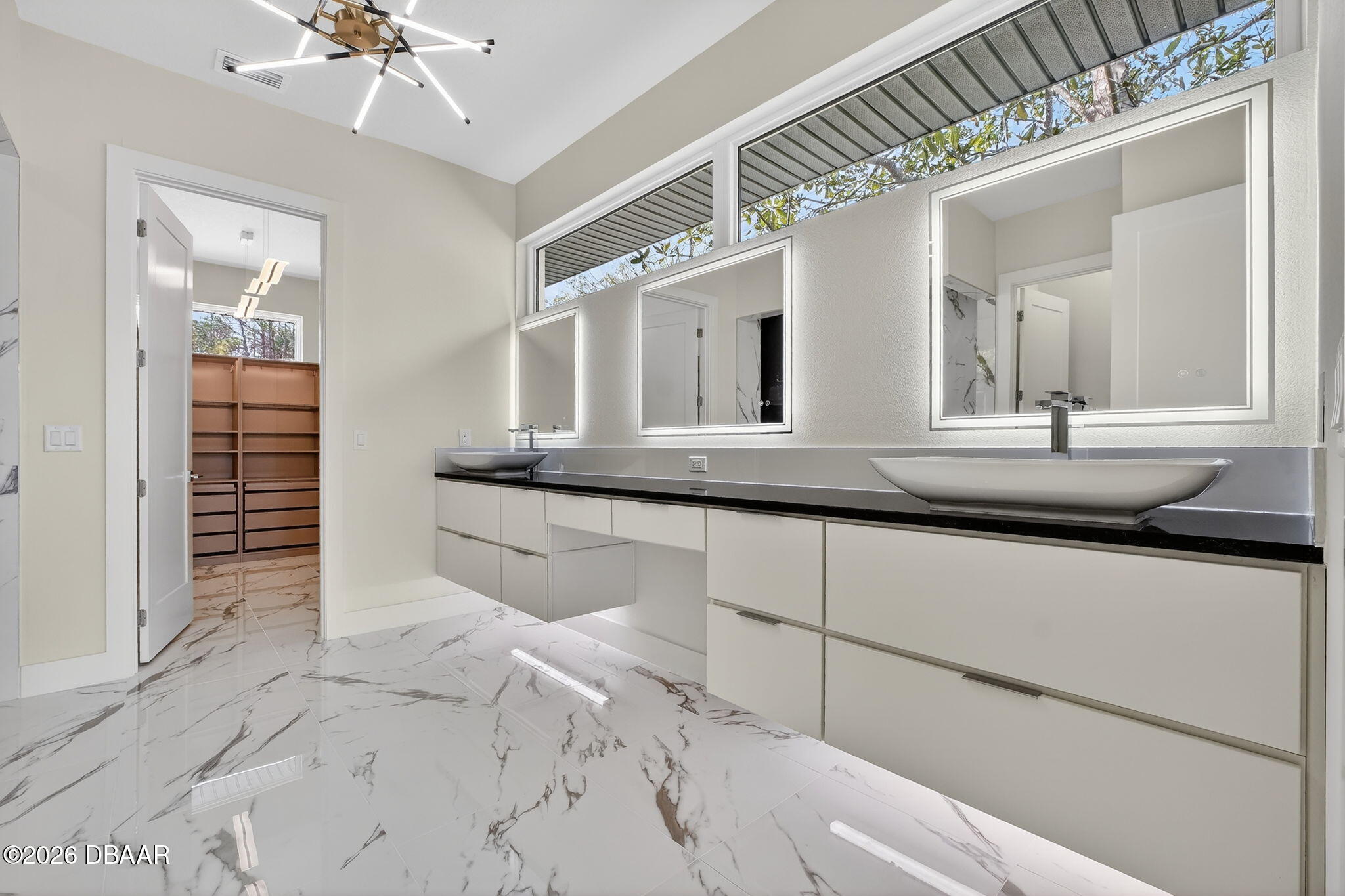 2 Huntsman Look Ormond Beach, FL 32174 - Photo 39 of 57 a bathroom with a sink and a mirror