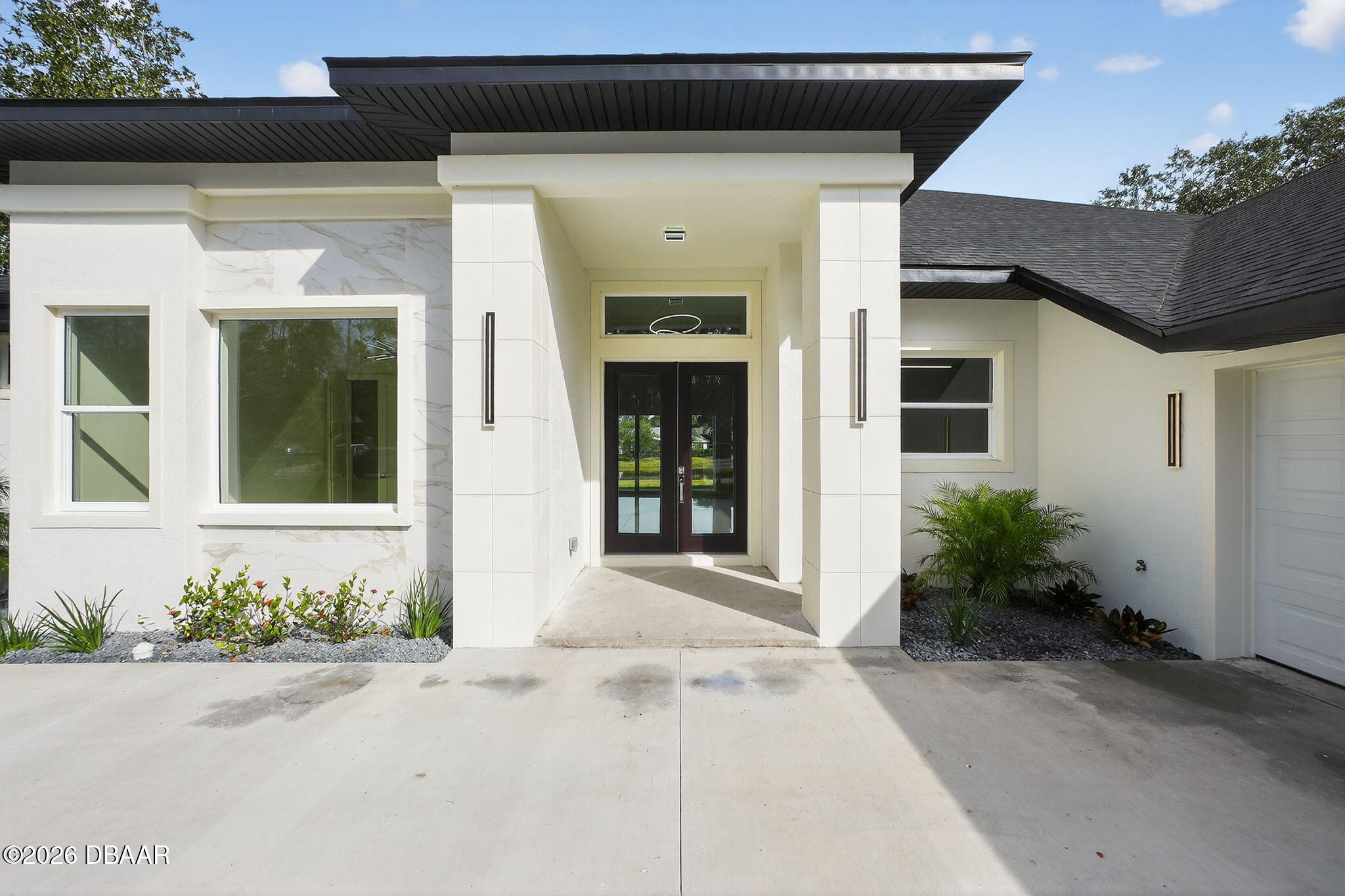 2 Huntsman Look Ormond Beach, FL 32174 - Photo 5 of 57 a front view of a house with garden