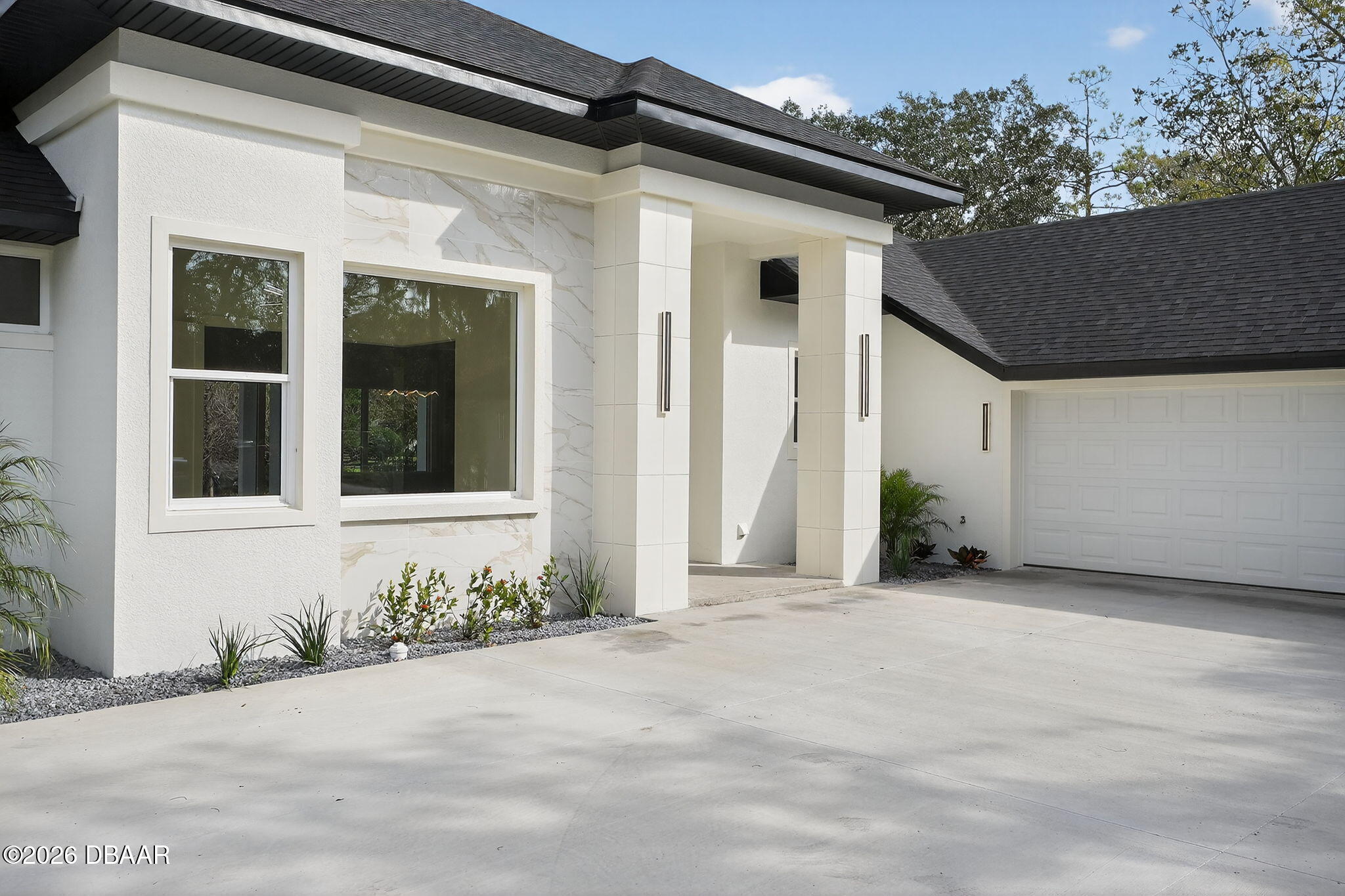 2 Huntsman Look Ormond Beach, FL 32174 - Photo 56 of 57 a front view of a house with a yard and garage