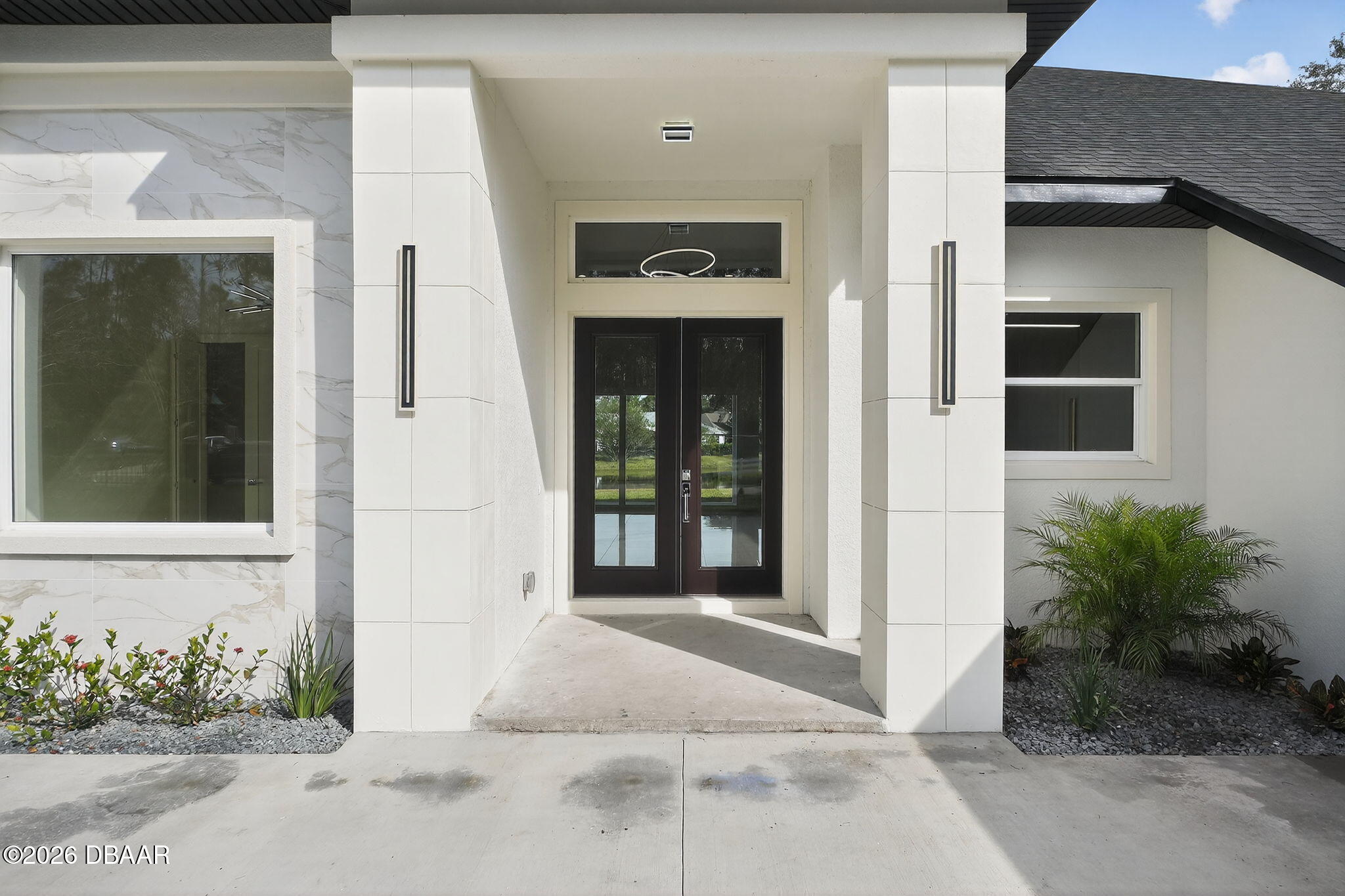 2 Huntsman Look Ormond Beach, FL 32174 - Photo 6 of 57 a front view of a house with a yard