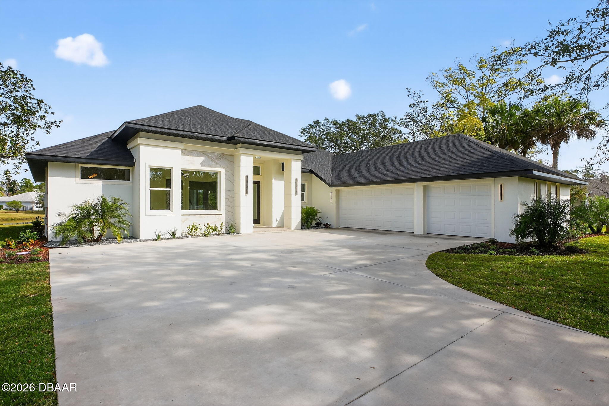 2 Huntsman Look Ormond Beach, FL 32174 - Photo 8 of 57 a front view of a house with a garden