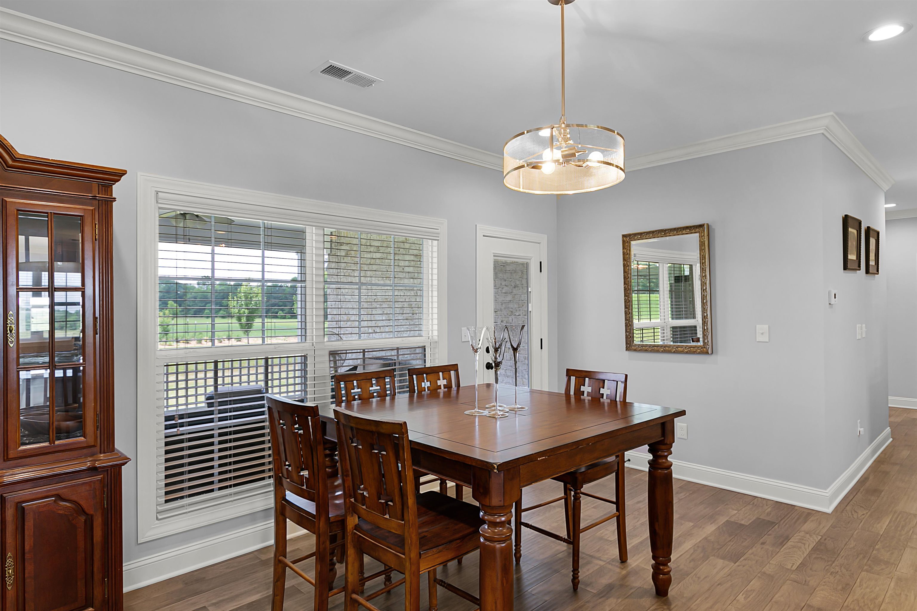 3250 Carroll Road Michie, TN 38357 - Photo 14 of 25 a view of a dining room with furniture wooden floor and chandelier