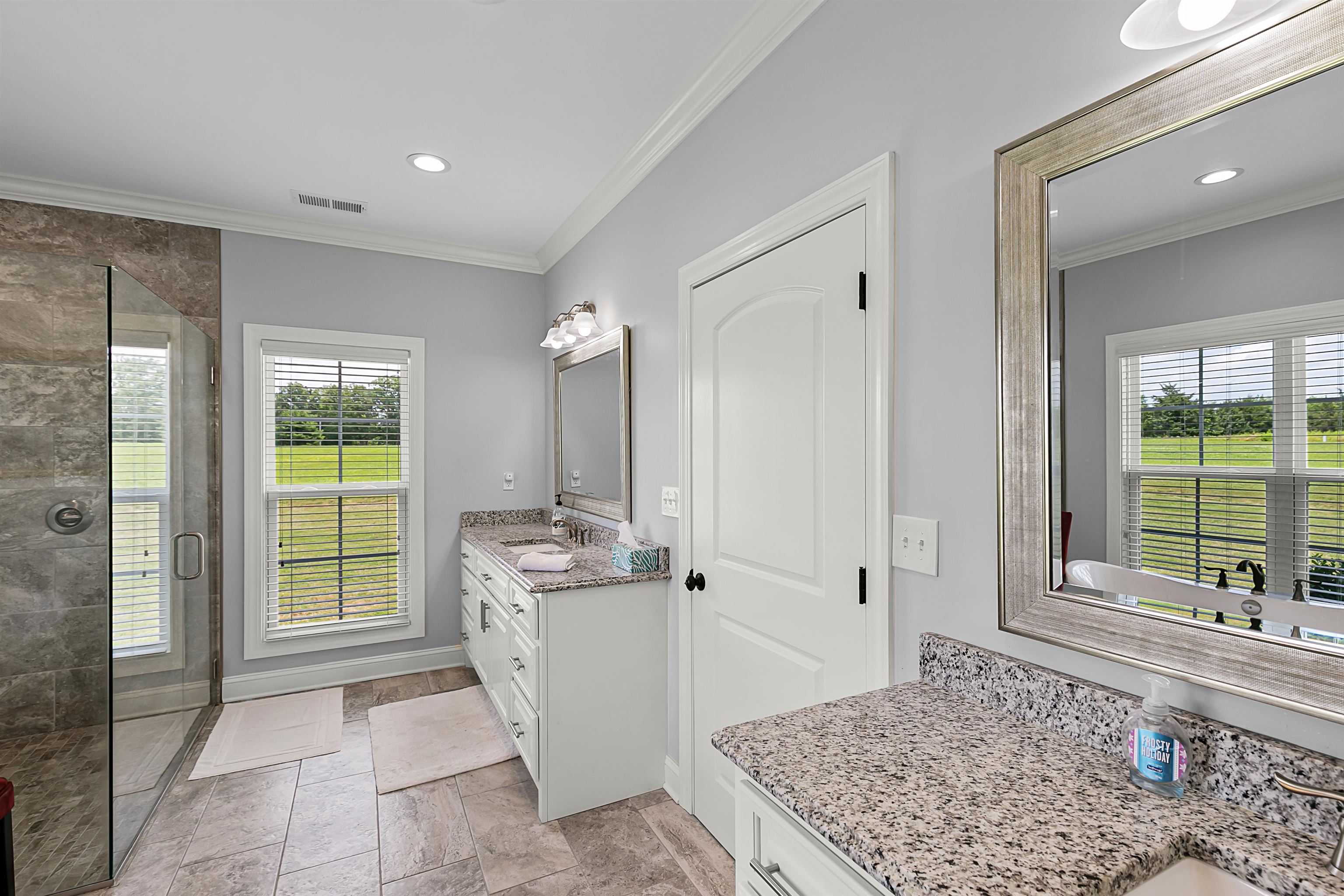 3250 Carroll Road Michie, TN 38357 - Photo 17 of 25 a spacious bedroom with a large bed and a window