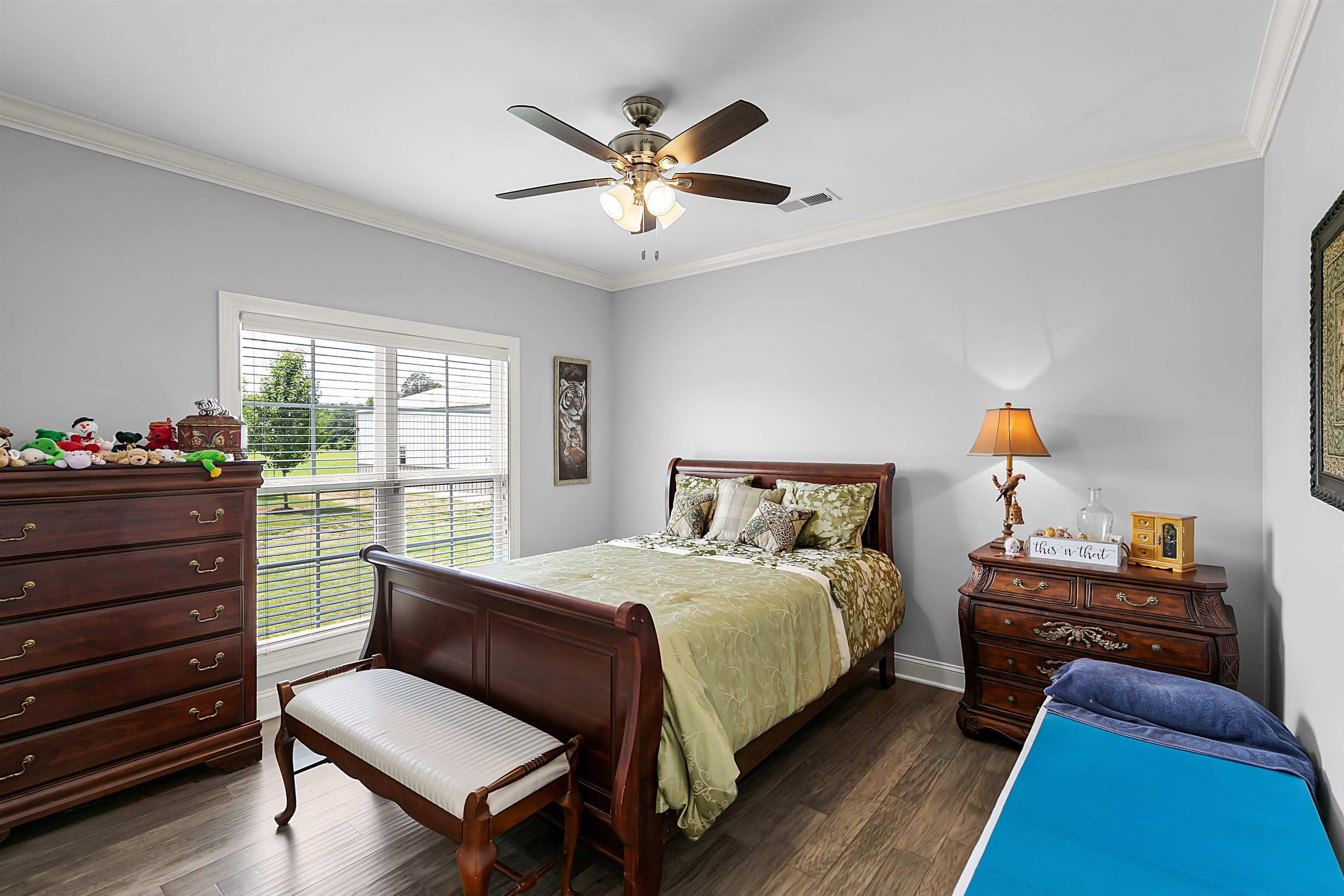 3250 Carroll Road Michie, TN 38357 - Photo 20 of 25 a bedroom with a bed and wooden floor