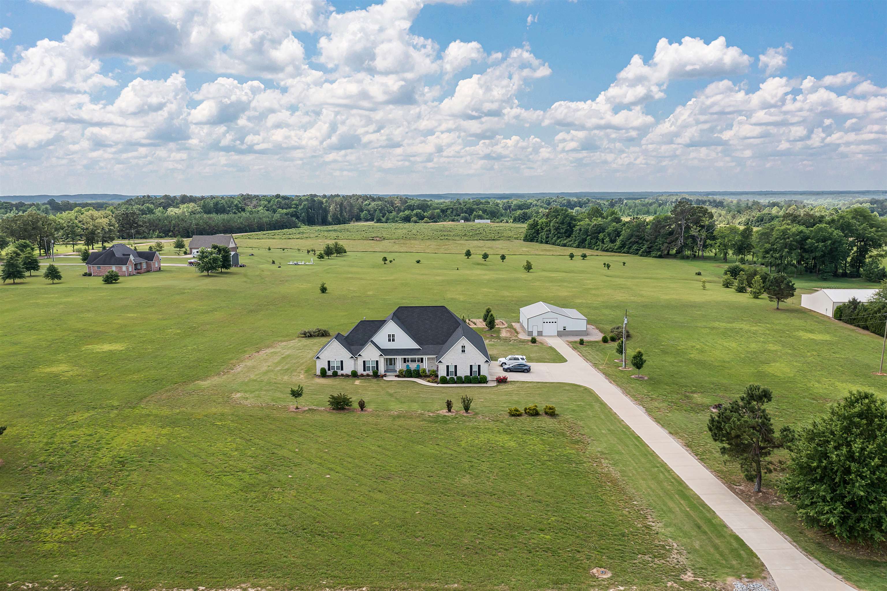 3250 Carroll Road Michie, TN 38357 - Photo 2 of 25 a view of a golf course with a garden