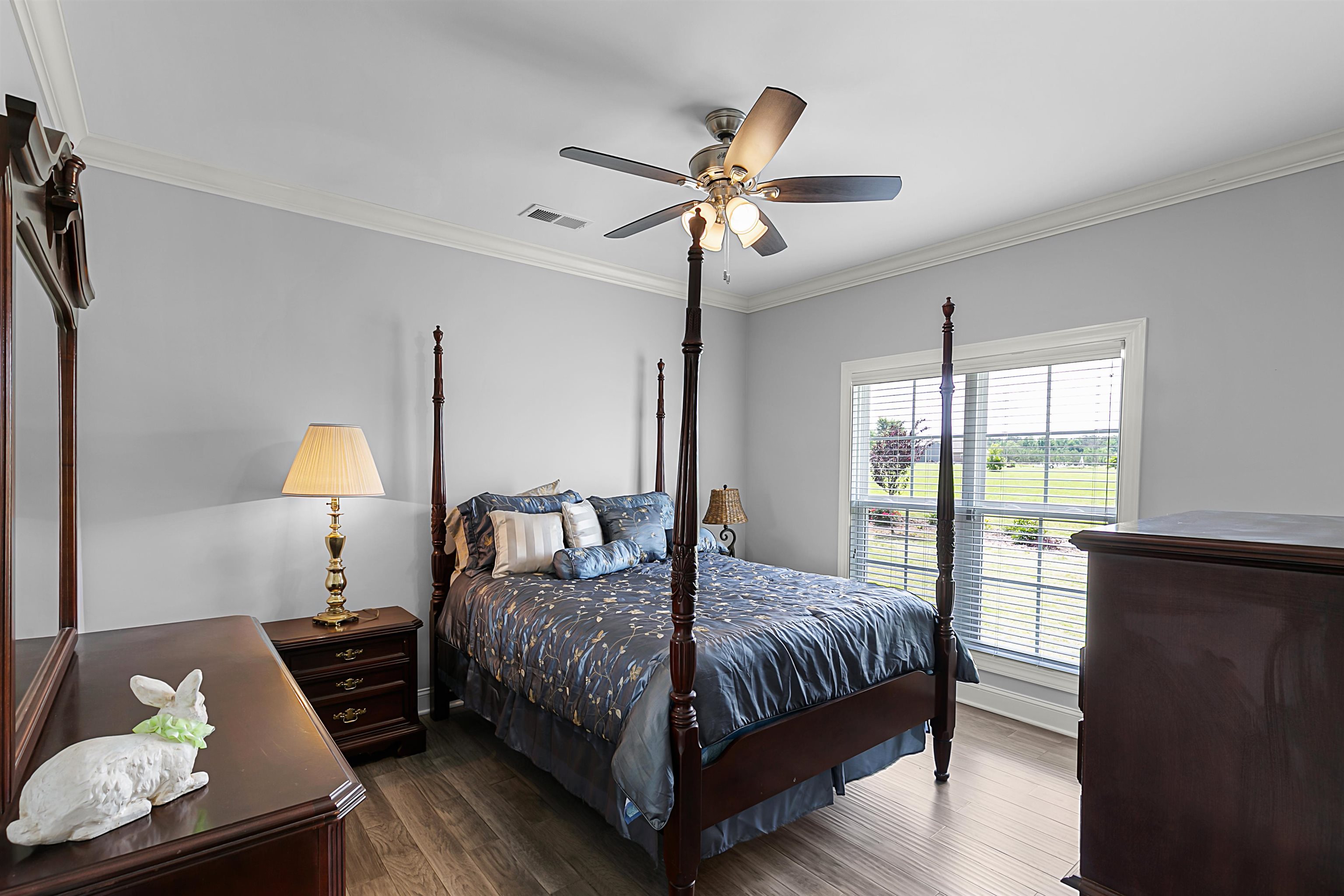 3250 Carroll Road Michie, TN 38357 - Photo 22 of 25 a bedroom with a bed and wooden floor