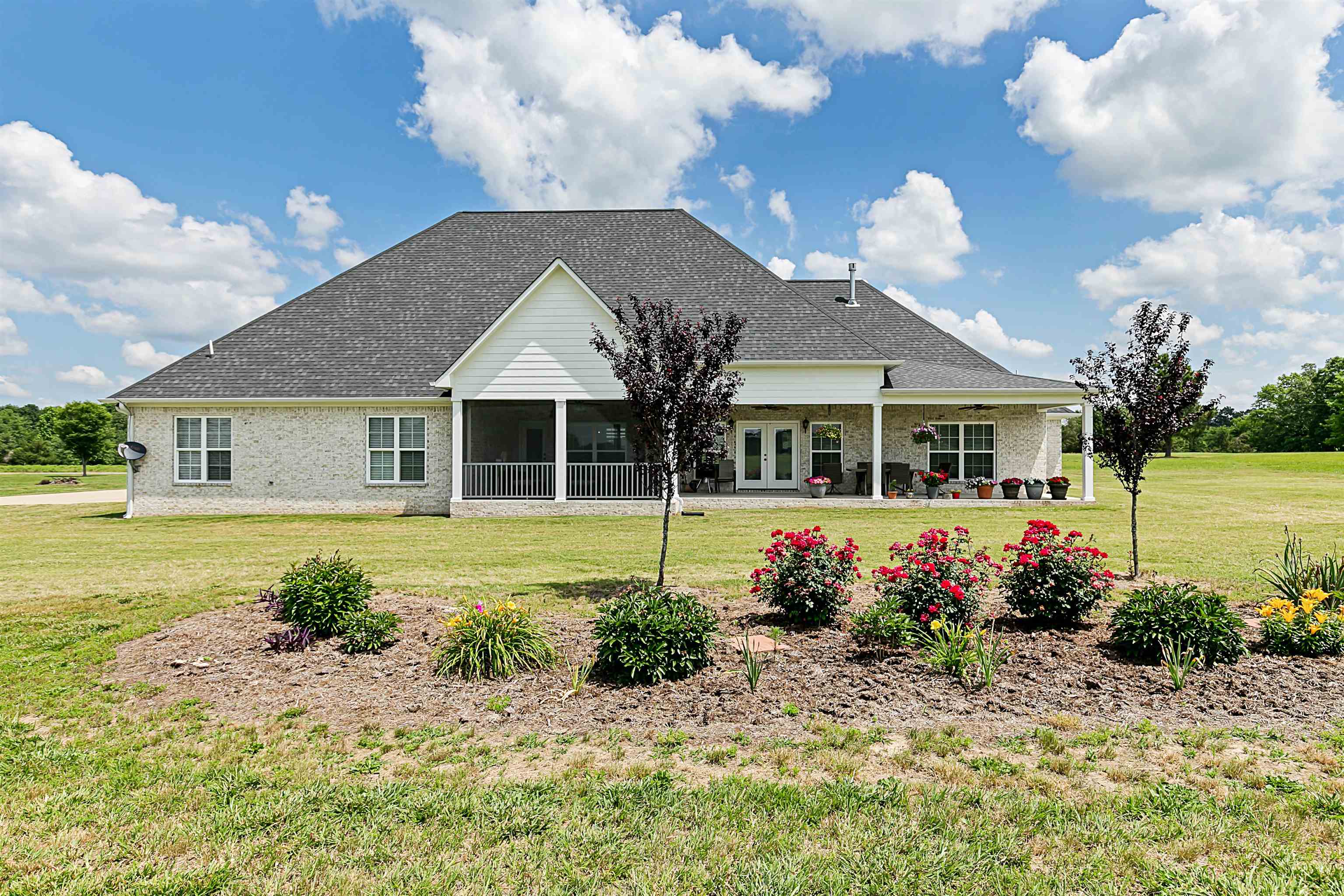3250 Carroll Road Michie, TN 38357 - Photo 3 of 25 a front view of a house with garden