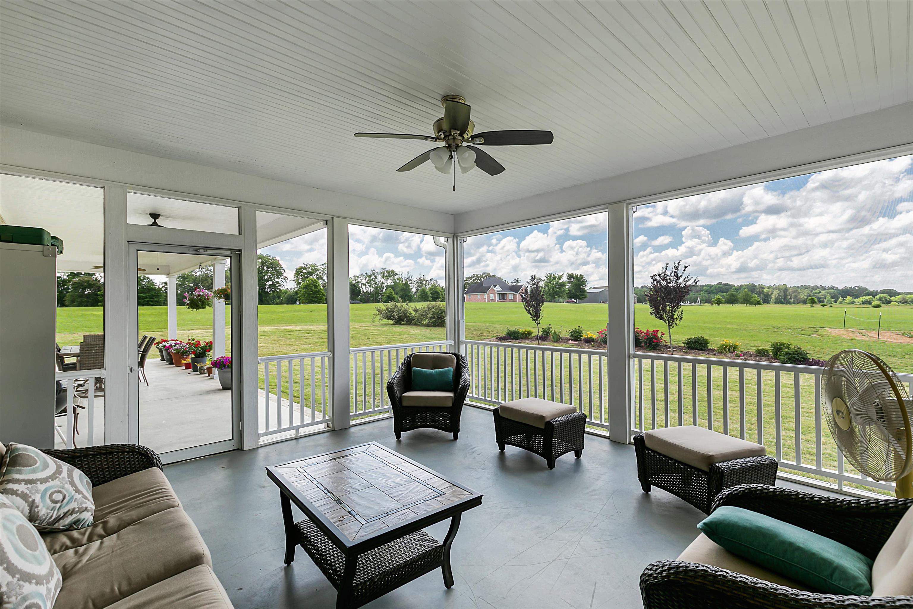 3250 Carroll Road Michie, TN 38357 - Photo 4 of 25 a living room with furniture and a floor to ceiling window