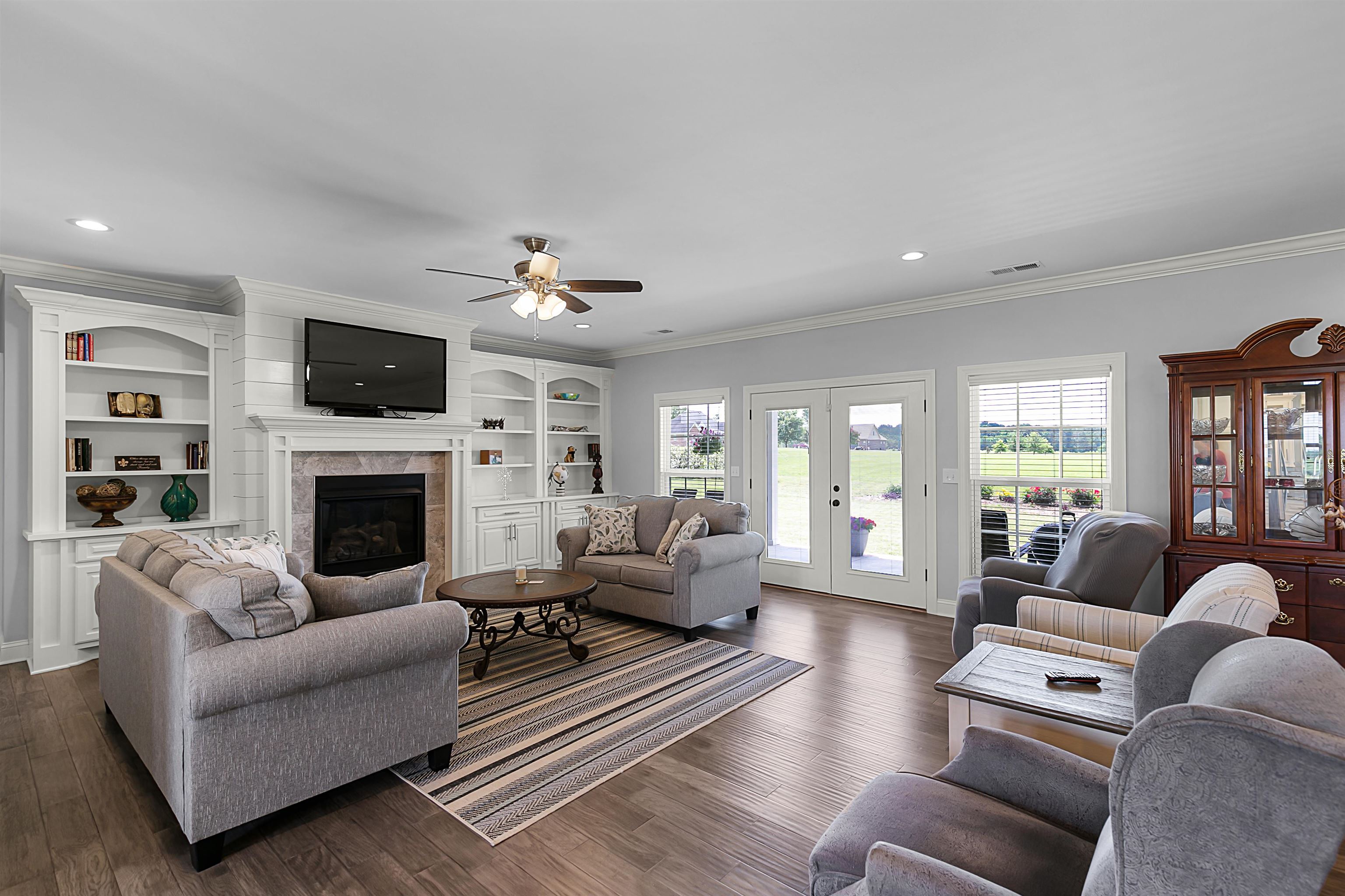 3250 Carroll Road Michie, TN 38357 - Photo 9 of 25 a living room with furniture a fireplace and a flat screen tv