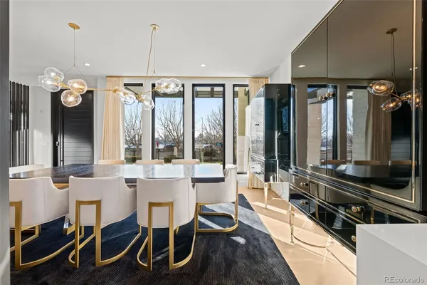 a large kitchen with a large window and stainless steel appliances