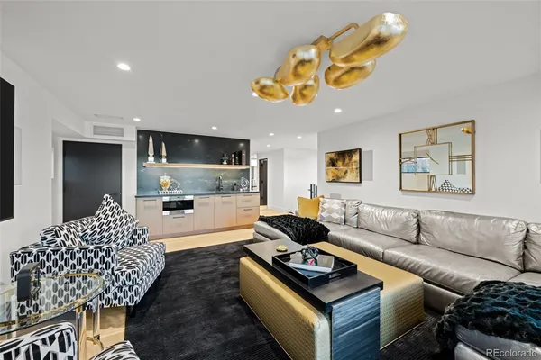 a living room with furniture large window and flat screen tv
