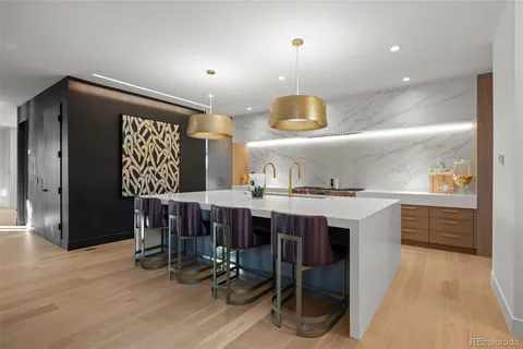 a kitchen with a table and chairs in it