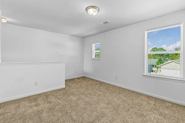 an empty room with windows