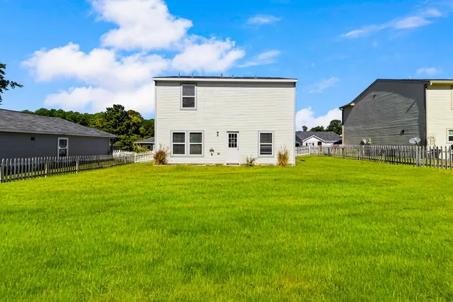 a view of a house with a back yard