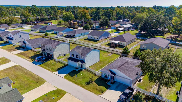 an aerial view of a house with a garden