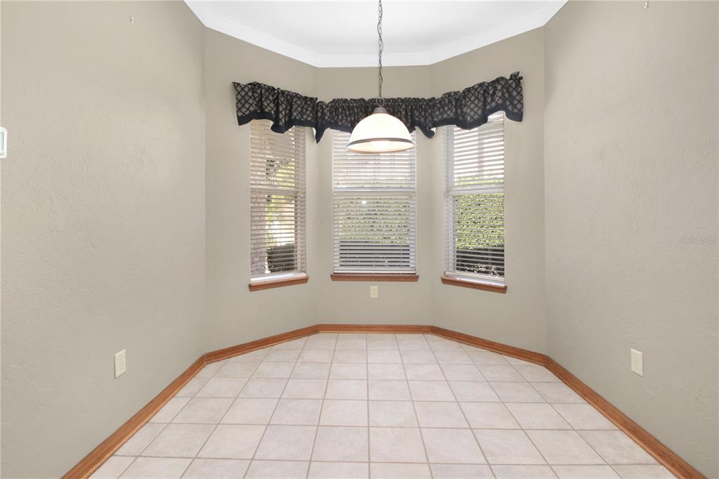 400 Interlachen Court DeBary, FL 32713 - Photo 14 of 42 a view of an empty room with windows
