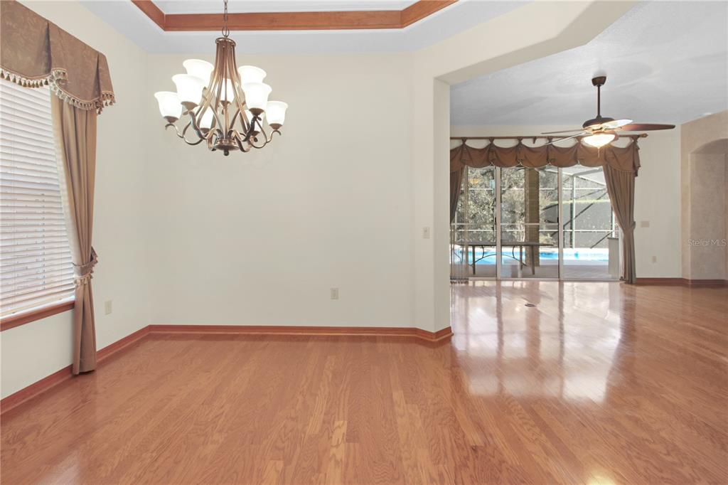 400 Interlachen Court DeBary, FL 32713 - Photo 15 of 42 wooden floor in an empty room with a window