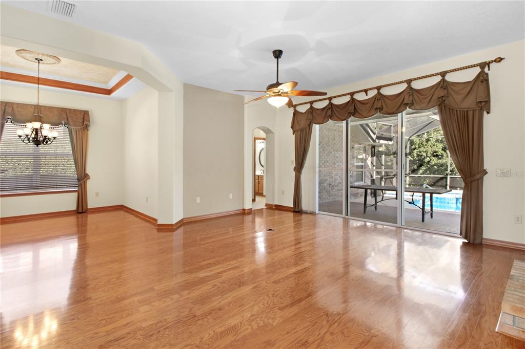 400 Interlachen Court DeBary, FL 32713 - Photo 18 of 42 a view of a room with wooden floor table and chairs