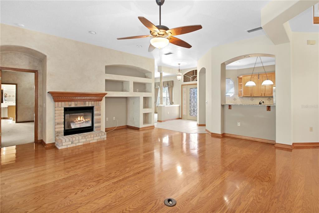 400 Interlachen Court DeBary, FL 32713 - Photo 20 of 42 a view of a livingroom with wooden floor and a ceiling fan
