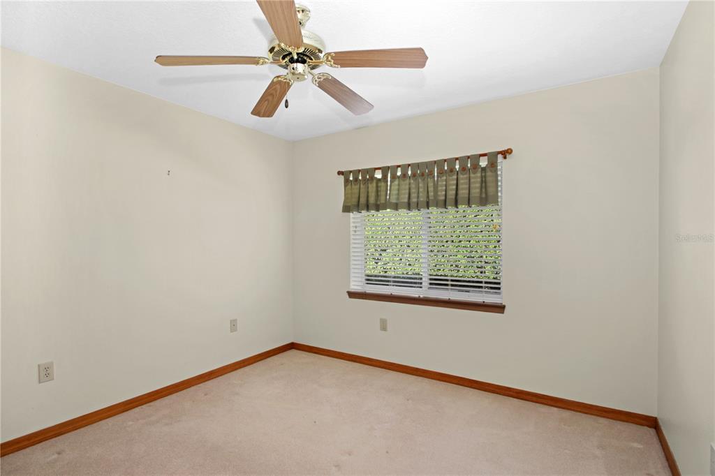 400 Interlachen Court DeBary, FL 32713 - Photo 21 of 42 a view of an empty room with a window
