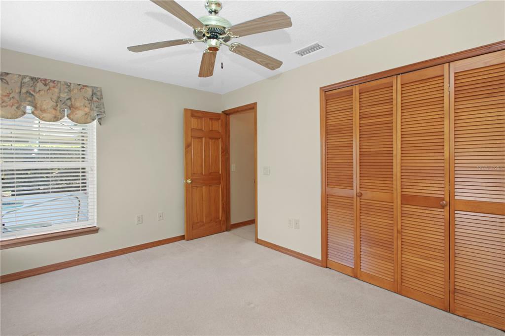 400 Interlachen Court DeBary, FL 32713 - Photo 25 of 42 a view of a livingroom with a ceiling fan and window