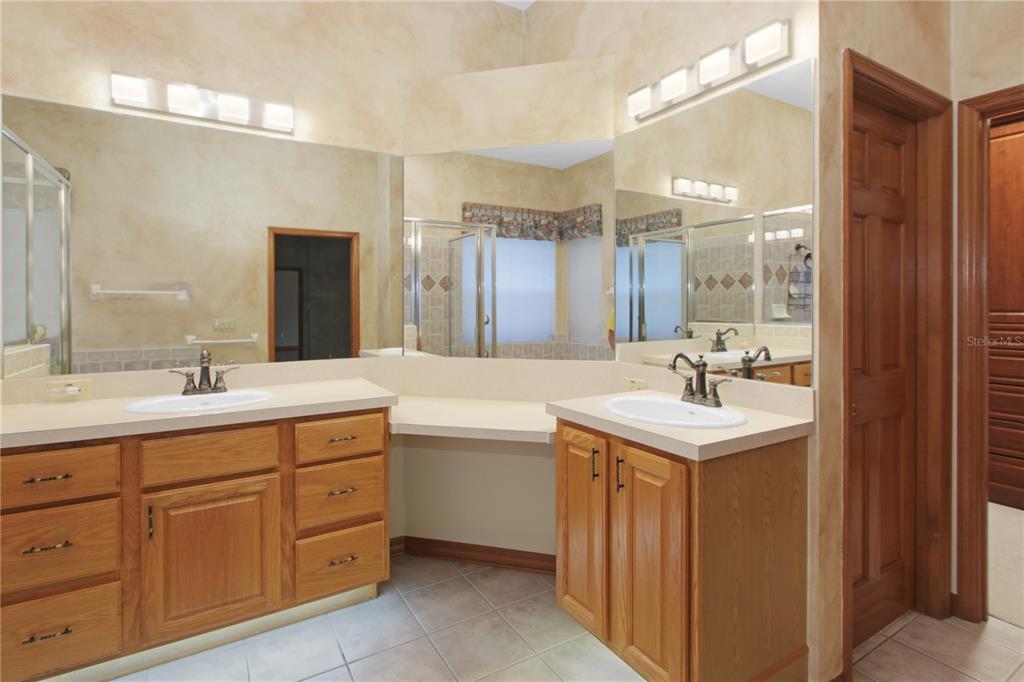 400 Interlachen Court DeBary, FL 32713 - Photo 29 of 42 a bathroom with a sink double vanity and a mirror